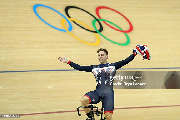 Philip Hindes of Great Britain celebrates after winning gold and getting an Olympic record in the Men's Team Sprint Track Cycling Finals on Day 6 of...