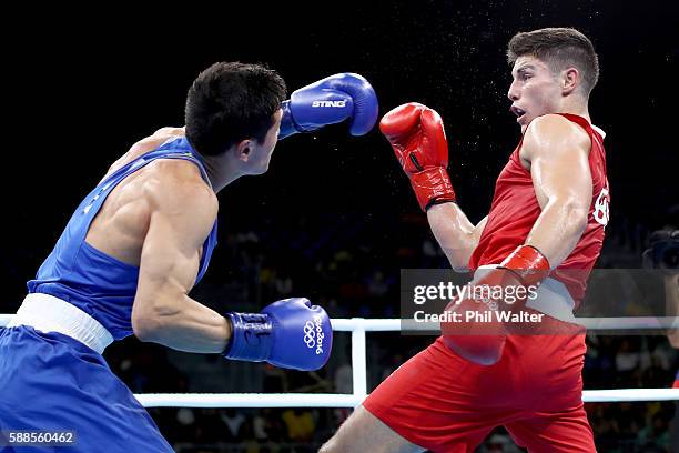 Daniyar Yeleussinov of Kazikstan fights Josh Kelly of Great Britain in their Mens Welterweight bout on Day 6 of the 2016 Rio Olympics at Riocentro -...