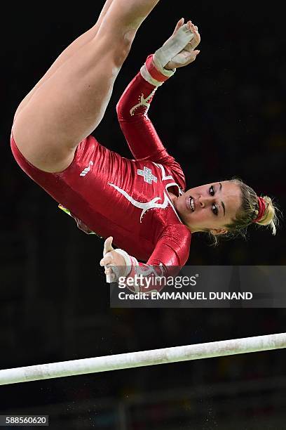 Switzerland's Giulia Steingruber competes in the uneven bars event of the women's individual all-around final of the Artistic Gymnastics at the...