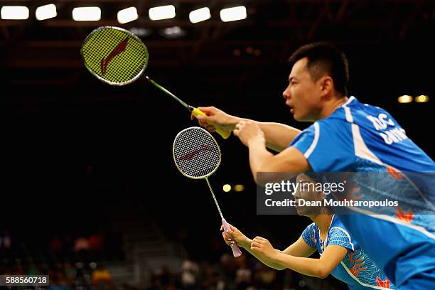 Ma Jin and Xu Chen of China compete against Chris and Gabby Adcock of Great Britain or Team GB in the badminton Mixed Doubles on Day 6 of the 2016...