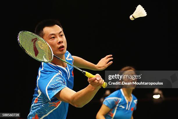 Ma Jin and Xu Chen of China compete against Chris and Gabby Adcock of Great Britain or Team GB in the badminton Mixed Doubles on Day 6 of the 2016...