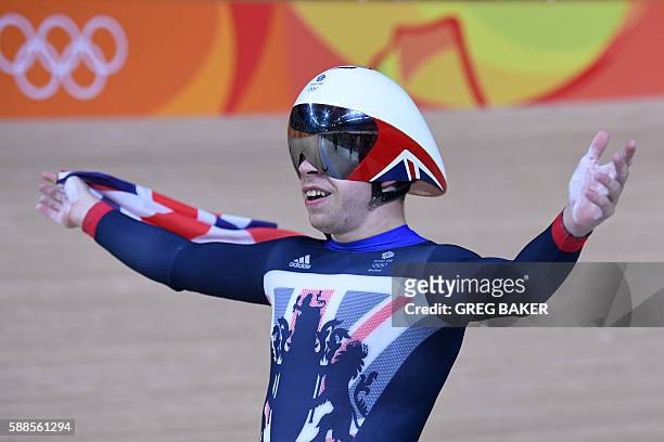 Britain's Philip Hindes celebrates after winning gold in the men's Team Sprint track cycling finals at the Velodrome during the Rio 2016 Olympic...