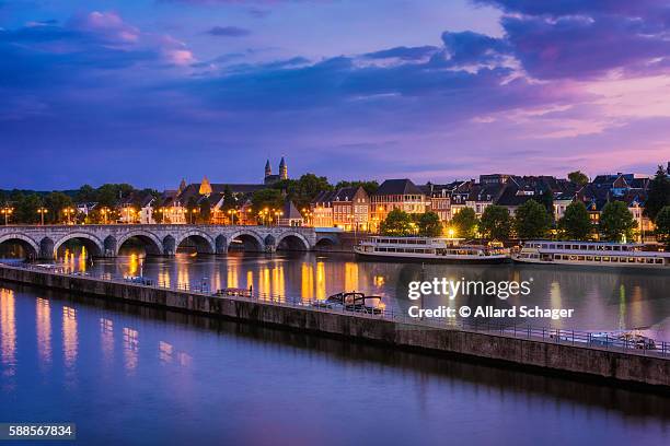 maastricht and maas river around sunset - maastricht stock pictures, royalty-free photos & images