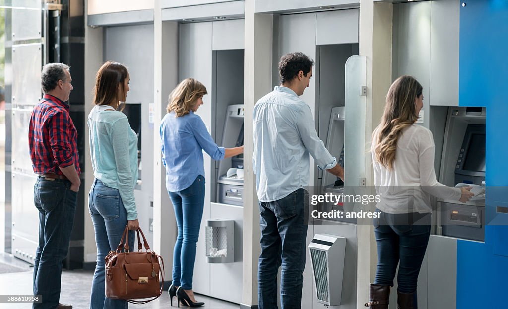 People in a line at an ATM