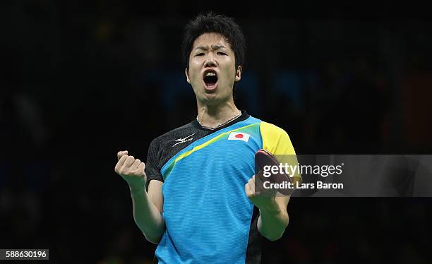 Jun Mizutani of Japan celebrates during the Mens Table Tennis Bronze Medal match between Jun Mizutani and Vladimir Samsonov of Belarus at Rio Centro...