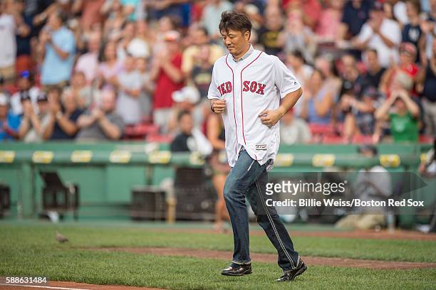 Former Boston Red Sox pitcher Hideki Okajima is introduced before throwing out a ceremonial first pitch before a game against the New York Yankees on...