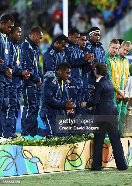 Princess Anne, Princess Royal presents the Fiji team with their gold medals during the medal ceremony for the Men's Rugby Sevens on Day 6 of the Rio...