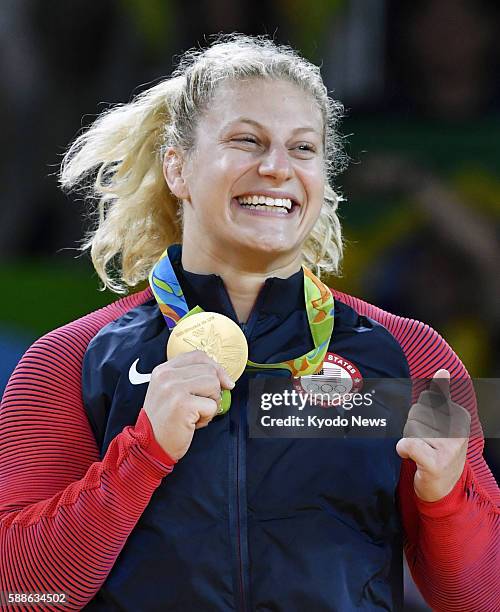 American judoka Kayla Harrison poses with her gold medal after winning the women's 78-kilogram category at the Rio de Janeiro Olympics on Aug. 11,...