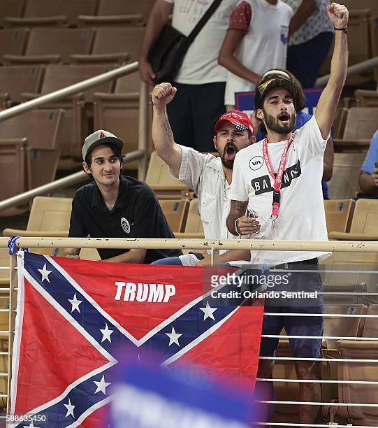 Protestors with a Confederate flag caused a stir when they were asked to remove the flag during a campaign rally for Republican presidential...