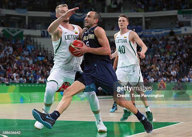 Manu Ginobili of Argentina drives to the basket against Domantas Sabonis of Lithuania and Marius Grigonis of Lithuania during the Men's Basketball -...