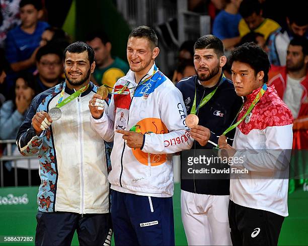 Under 100kg judo medallists L-R: Silver; Elmar Gasimov of Azerbaijan , Gold; Lukas Krpalek of the Czech Republic, Bronzes; Cyrille Maret of France...