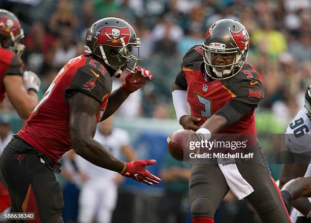 Jameis Winston hands the ball off to Mike James of the Tampa Bay Buccaneers in the first quarter against the Philadelphia Eagles at Lincoln Financial...