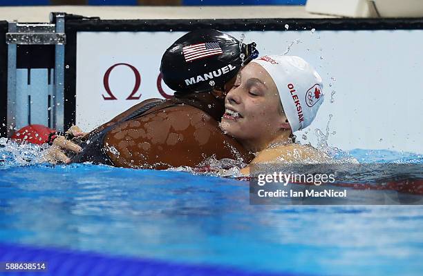Penny Oleksiak of Canada and Simone Manuel of United States hug after the final of the Women's 100m Freestyle on Day 6 of the Rio 2016 Olympic Games...