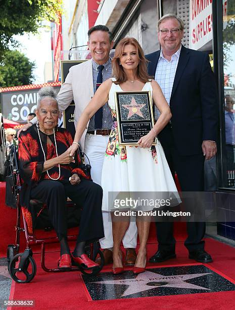 Actress Della Reese, producer Mark Burnett, actress Roma Downey and pastor Rick Warren of Saddleback Church attend Roma Downey being honored with a...