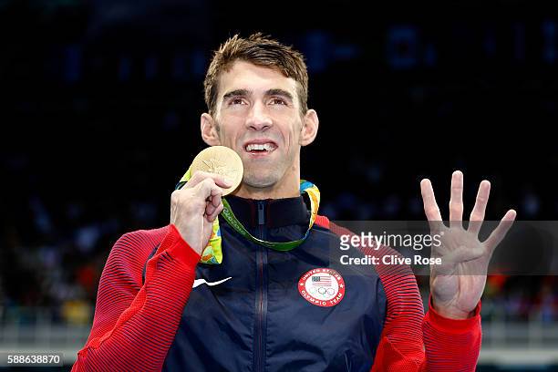 Gold medalist Michael Phelps of the United States celebrates during the medal ceremony for the Men's 200m Individual Medley Final on Day 6 of the Rio...