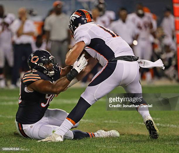 Cornelius Washington of the Chicago Bears sacks Paxton Lynch of the Denver Broncos at Soldier Field on August 11, 2016 in Chicago, Illinois. The...