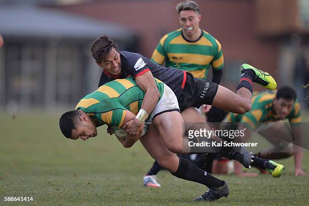 Vincent Sakaria of Wellington is tackled by Ben Volavola of the Cantabrians during the rugby match between the Cantabrians and Wellington at Rugby...