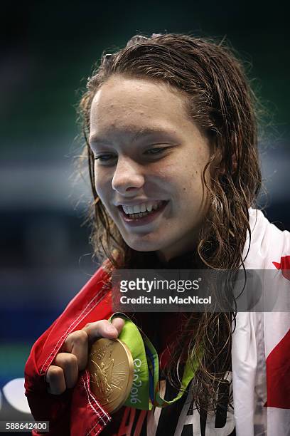 Penny Oleksiak of Canada poses with her Gold medal from the Women's 100m Freesyle on Day 6 of the Rio 2016 Olympic Games at the Olympic Aquatics...