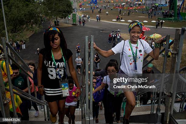 Children from the Cantagalo 'favela' community arrive at the Olympic Rugby 7's venue on August 11, 2016 in Rio de Janeiro, Brazil. A small group of...
