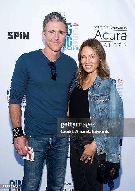 Player Chase Utley and Jennifer Cooper arrive at Clayton Kershaw's 4th Annual Ping Pong 4 Purpose Celebrity Tournament at Dodger Stadium on August...