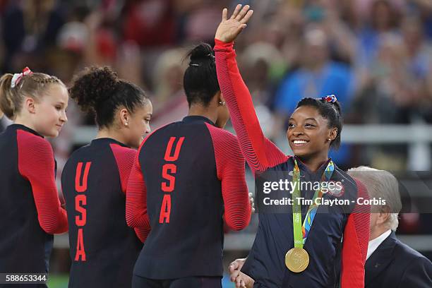 Gymnastics - Olympics: Day 4 Simone Biles of the United States on the podium with her gold medal during the Artistic Gymnastics Women's Team Final at...