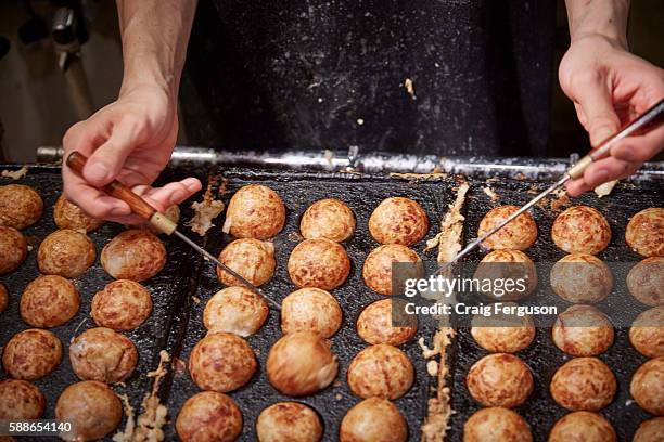 Takoyaki are a batter made of wheat flour filled with octopus, green onion, pickled ginger and tempura scraps. They are cooked in a special pan, and...