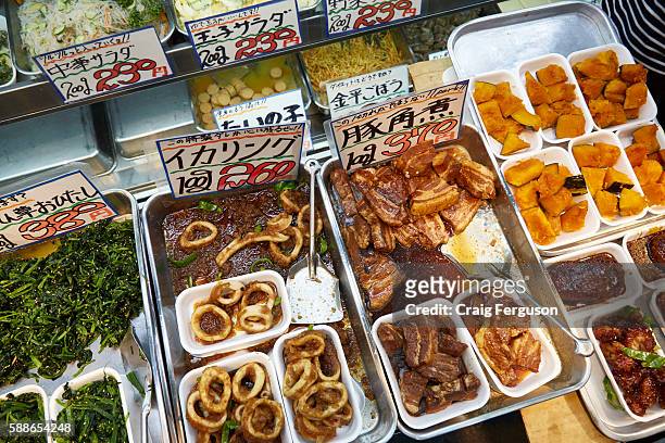 Food for sale at Kuromon Ichiba Market. The market is known as Osaka's Kitchen, and offers a large variety of fresh and cooked food.