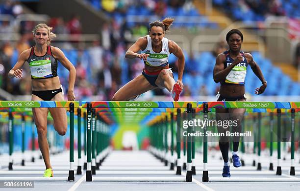 Brianne Theisen Eaton of Canada, Jessica Ennis-Hill of Great Britain and Antoinette Nana Djimou Ida of France compete in the Women's Heptathlon 100...