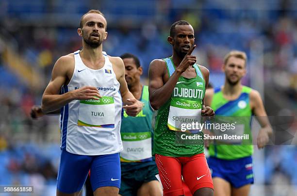 Amel Tuka of Bosnia and Herzegovina and Ayanleh Souleiman of Djibouti compete in round one of the Men's 800 metres on Day 7 of the Rio 2016 Olympic...