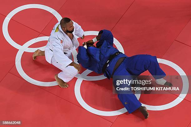 Netherlands' Roy Meyer competes with Congo's Deo Gracia Ngokaba during their men's +100kg judo contest match of the Rio 2016 Olympic Games in Rio de...