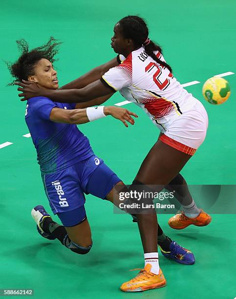 Ana Paula Belo of Brazil is challenged by Liliana da Silva Venancio of Angola during the Womens Preliminary Group A match between Angola and Brazil...