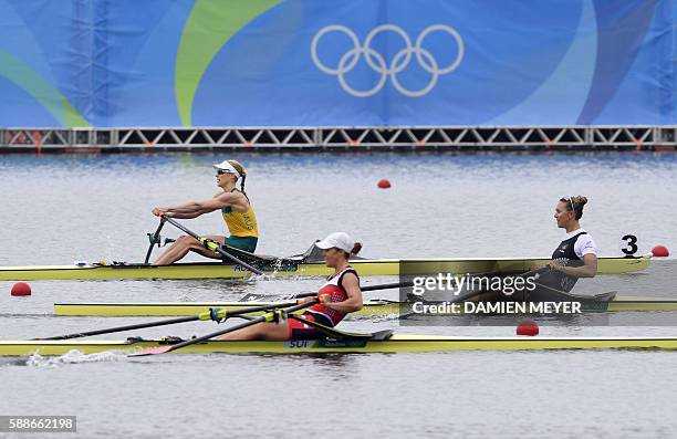 Australia's Kimberley Brennan, Switzerland's Jeanine Gmelin and New Zealand's Emma Twigg row during the Women's Single Sculls semifinal rowing...