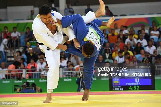 South Korea's Kim Sungmin competes with Ecuador's Freddy Figueroa during their men's +100kg judo contest match of the Rio 2016 Olympic Games in Rio...