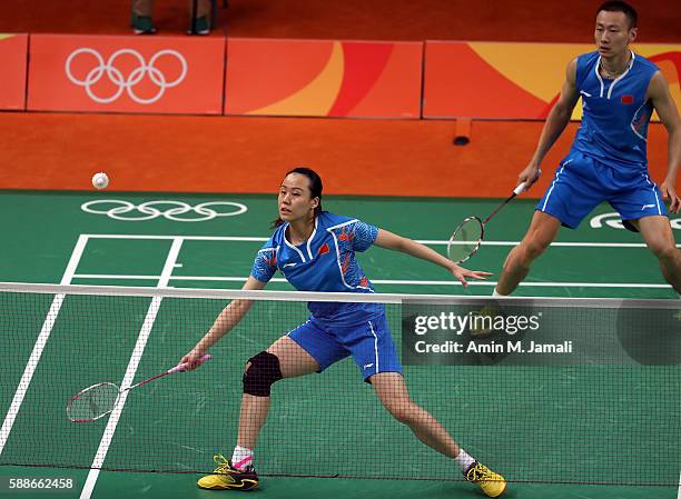 Zhang Nan and Zhao Yunlei of China competes against Lee Chun Hei and Chau Hoi WahReginald of Hong Kong in the badminton mixed Doubles on Day 7 of the...