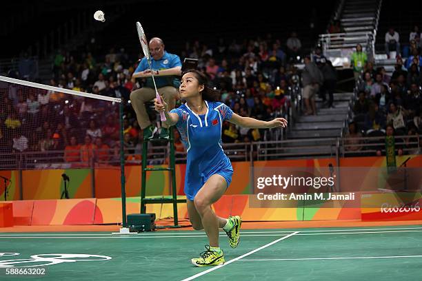 Jin Ma of China of China competes against Nadiezda Zieba and Robert Mateusiak of Poland in the badminton Mixed Double on Day 7 of the 2016 Rio...