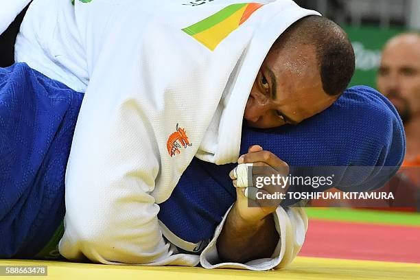 Netherlands' Roy Meyer competes with South Korea's Kim Sungmin during their men's +100kg judo contest match of the Rio 2016 Olympic Games in Rio de...