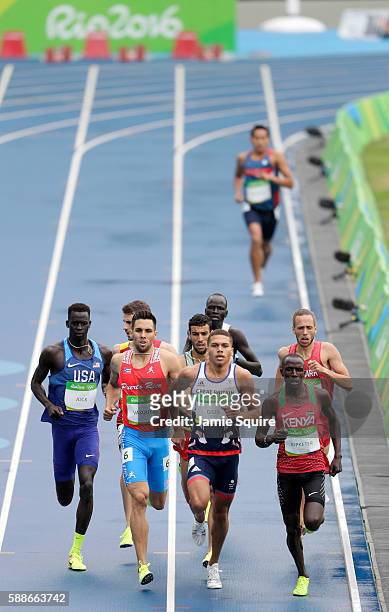 Charles Jock of the United States, Wesley Vazquez of Puerto Rico, Elliot Giles of Great Britain and Alfred Kipketer of Kenya compete in round one of...