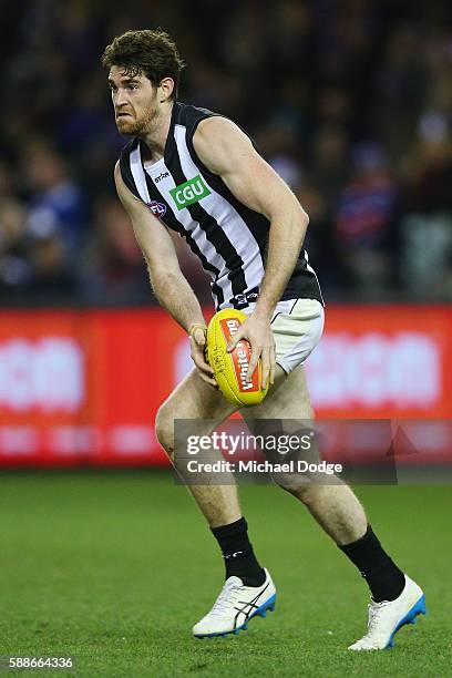 Tyson Goldsack of the Magpies looks upfield during the round 21 AFL match between the Western Bulldogs and the Collingwood Magpies at Etihad Stadium...