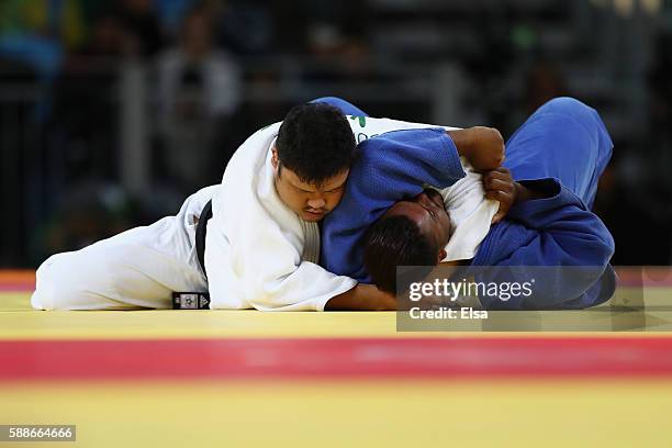 Kim Sung-min of South Korea competes against Freddy Figureoa of Ecuador during the Men's +100kg Judo contest on Day 7 of the Rio 2016 Olympic Games...