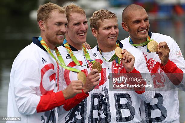 Gold medalists Alex Gregory, Mohamed Sbihi, George Nash and Constantine Louloudis of Great Britain pose for photographs on the podium at the medal...