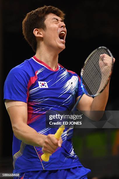 South Korea's Lee Yong Dae reacts during his men's doubles qualifying badminton match witth teammate South Korea's Yoo Yeon Seong against Taiwan's...