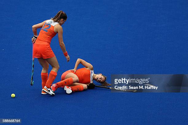 Lidewij Welten of Netherlands comes to the aid of Kelly Jonker of Netherlands against New Zealand during a Women's Preliminary Pool A match on Day 7...