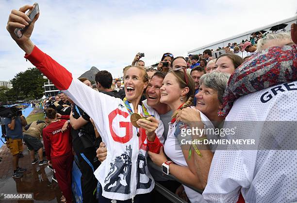 Britain's Helen Glover takes a selfie photo after the podium of the Women's Pair final rowing competition at the Lagoa stadium during the Rio 2016...