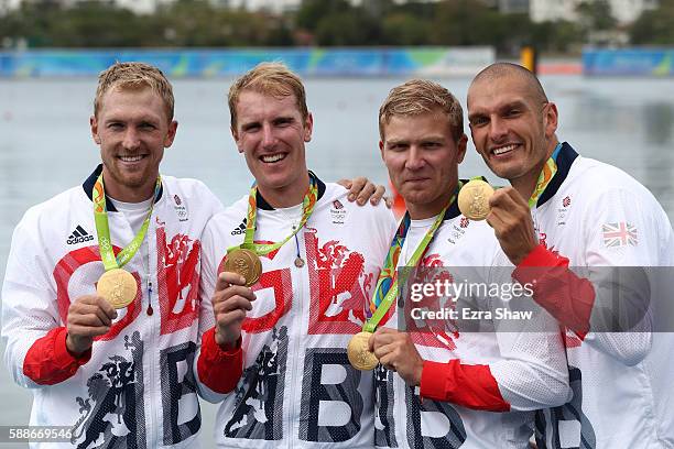 Gold medalists Alex Gregory, Mohamed Sbihi, George Nash and Constantine Louloudis of Great Britain pose for photographs on the podium at the medal...