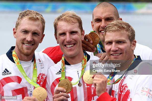 Gold medalists Alex Gregory, Mohamed Sbihi, George Nash and Constantine Louloudis of Great Britain pose for photographs on the podium at the medal...