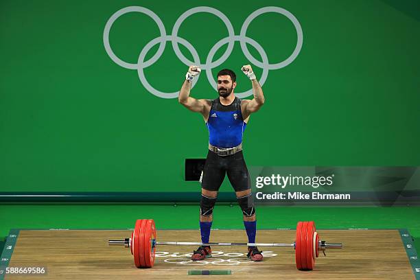 Theodoros Iakovidis of Greece celebrates during the Weightlifting - Men's 85kg Group B on Day 7 of the Rio 2016 Olympic Games at Riocentro - Pavilion...