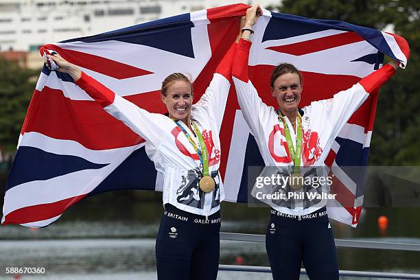 Gold medalists Helen Glover and Heather Stanning of Great Britain pose for photographs after the medal ceremony for the Women's Pair on Day 7 of the...