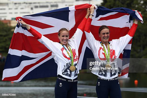 Gold medalists Helen Glover and Heather Stanning of Great Britain pose for photographs after the medal ceremony for the Women's Pair on Day 7 of the...