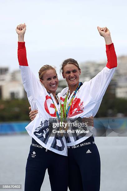 Gold medalists Helen Glover and Heather Stanning of Great Britain celebrate on the podium at the medal ceremony for the Women's Pair on Day 7 of the...