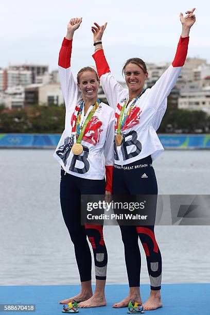 Gold medalists Helen Glover and Heather Stanning of Great Britain celebrate on the podium at the medal ceremony for the Women's Pair on Day 7 of the...